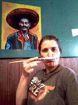 Deborah King painting Zapata Mural